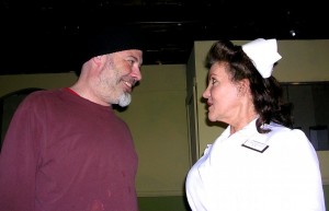 R.P. McMurphy (Mark Axelson) confronts Nurse Ratched (Carol Vancil) in a monumental battle of wills.